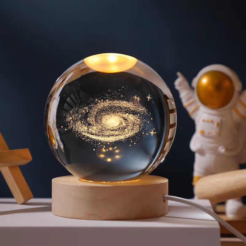 Crystal Ball Engraved Lamp with solar system laser-engraving, USB-powered warm light, and elegant wooden base. Perfect for bedroom decor, unique gifts, or creating a cosmic ambiance in any space.